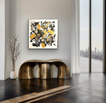 Load image into Gallery viewer, Modern interior with abstract art, gold bench, and cityscape view