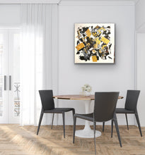 Load image into Gallery viewer, Dining room with a round table and black chairs, abstract art on the wall.