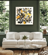 Load image into Gallery viewer, White sofa in a living room with a colorful abstract painting on the wall.