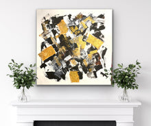 Load image into Gallery viewer, Abstract art piece with gold and black patterns on a white wall above a fireplace.