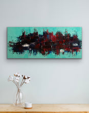 Load image into Gallery viewer, Abstract painting with red and black on a teal background, displayed above a wooden table with a vase and cup.