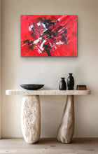 Load image into Gallery viewer,  Original Abstract red painting above a stone table with decorative items.