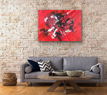 Load image into Gallery viewer, Living room with a gray sofa, round wooden coffee table, and original abstract red painting by Tony Hammer on a brick wall.