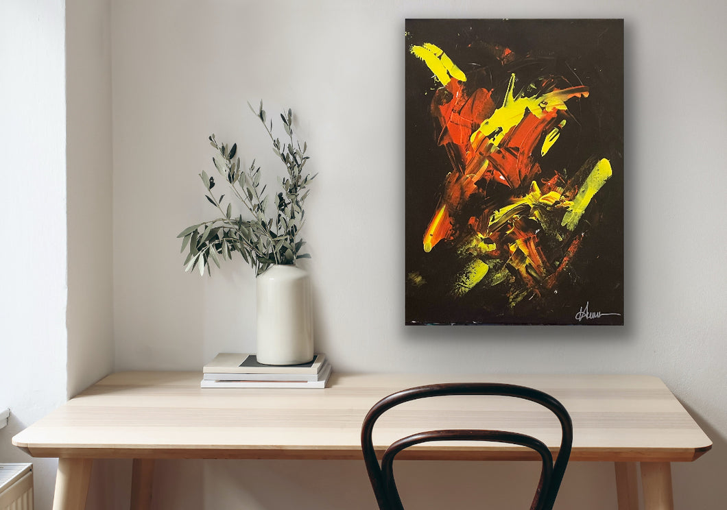Tony Hammer Abstract limited Edition on a wall above a wooden table with a vase and plant.