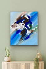 Load image into Gallery viewer, Abstract painting on a wall above a wooden cabinet with decorative items.