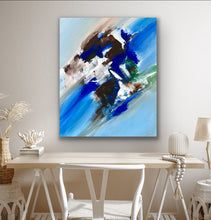 Load image into Gallery viewer, Abstract painting on a wall above a wooden table with decorative items.