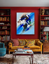 Load image into Gallery viewer, Living room with a yellow sofa, colorful pillows, and a painting on a red wall.