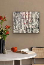 Load image into Gallery viewer, Abstract painting on a wall above a table with a cup and vase, against a beige background.