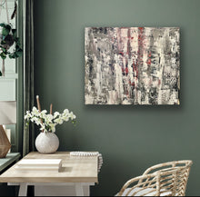 Load image into Gallery viewer, Abstract painting on a wall above a table with a vase and books, against a green wall.