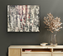 Load image into Gallery viewer, Abstract painting on a dark wall above a wooden cabinet with decorative items.