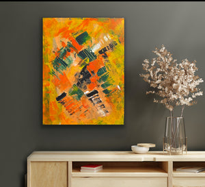 Abstract painting on a wall above a wooden console table with decorative items.