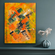 Load image into Gallery viewer, Abstract painting with orange, yellow, and green colors on a dark gray wall, next to a vase with white flowers.