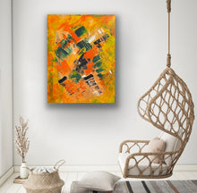 Load image into Gallery viewer, Abstract painting on a wall above a wicker chair with a cushion.
