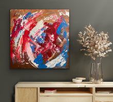 Load image into Gallery viewer, Abstract painting with red, blue, and white on a brown background, displayed on a wall above a wooden cabinet.