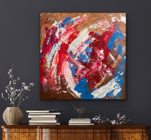 Load image into Gallery viewer, Abstract painting with red, blue, and white on a dark wall above a wooden cabinet.
