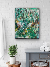 Load image into Gallery viewer, Abstract painting on a white brick wall with a plant and cabinet below.